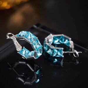Half-hoop earrings channel-set with square emerald-cut AAA cubic zirconia stones, available in clear silver, aqua blue, and peridot green options.