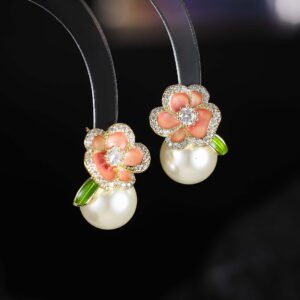 Enamel flower pearl stud earrings featuring micro-paved CZ petal borders, center round stone, glossy pearl drop, and 925 sterling silver ear posts
