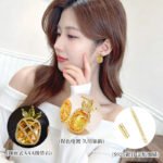 Sparkling pineapple stud earrings featuring marquise-cut crystal crown leaves, lattice fruit body, and micro-pavé accents in yellow, pink, and clear options.