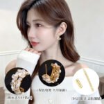 Mother of pearl flower hoop earrings featuring carved shell flower petals, sparkling AAA cubic zirconia accents, 18K gold-plated C-shape hoop base, and 925 sterling silver ear posts.