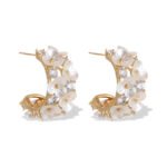 Mother of pearl flower hoop earrings featuring carved shell flower petals, sparkling AAA cubic zirconia accents, 18K gold-plated C-shape hoop base, and 925 sterling silver ear posts.