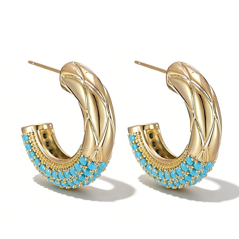 Chunky quilted diamond-pattern C-shaped half hoop earrings with a micro-set turquoise bead trim on the bottom edge, available in gold and silver metal finishes.