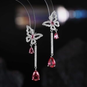 Butterfly CZ long dangle earrings featuring a micro-paved crystal butterfly top, asymmetric teardrop gemstone drops, and 925 sterling silver ear posts.