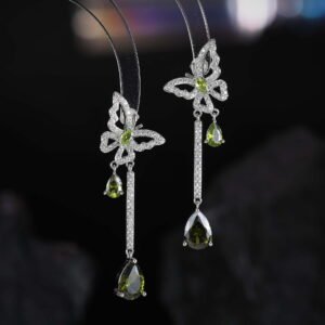 Butterfly CZ long dangle earrings featuring a micro-paved crystal butterfly top, asymmetric teardrop gemstone drops, and 925 sterling silver ear posts.