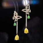 Butterfly CZ long dangle earrings featuring a micro-paved crystal butterfly top, asymmetric teardrop gemstone drops, and 925 sterling silver ear posts.