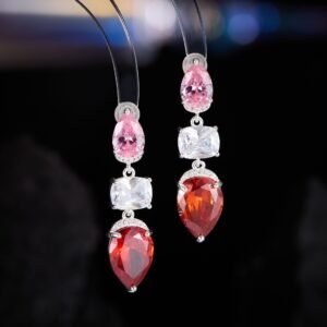 Three stone CZ drop dangle earrings featuring a pear-cut top stone, clear cushion-cut center, and teardrop bottom gem with 925 sterling silver posts