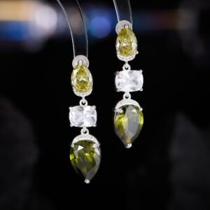 Three stone CZ drop dangle earrings featuring a pear-cut top stone, clear cushion-cut center, and teardrop bottom gem with 925 sterling silver posts