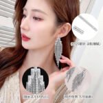 Long tassel CZ fringe drop earrings featuring multi-tier cubic zirconia waterfall chains, baguette crystal top, and 925 sterling silver posts.