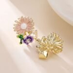 Enamel sunflower garden stud earrings featuring hand-painted enamel petals, green leaves, crystal accents, and 925 sterling silver posts