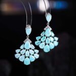 Pear-shaped crackle crystal chandelier drop earrings with pavé CZ accents, available in light blue, soft pink, and multicolor pastel tones.