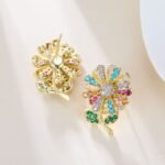 Sparkling CZ sunflower stud earrings wholesale featuring pave-set cubic zirconia flower petals, leafed stems, and 925 sterling silver posts available on junejewelry.com