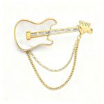 Cool rock style natural mother of pearl guitar brooch pin wholesale featuring 18K real gold plated copper, baguette CZ neck, and draped chain tassels from junejewelry.com