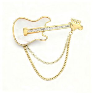 Cool rock style natural mother of pearl guitar brooch pin wholesale featuring 18K real gold plated copper, baguette CZ neck, and draped chain tassels from junejewelry.com