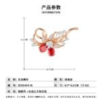 Dazzling rose gold flower brooch wholesale featuring micro-pave cubic zirconia petals, round crystal accents, and pear-cut red crystal gems from junejewelry.com