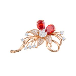 Dazzling rose gold flower brooch wholesale featuring micro-pave cubic zirconia petals, round crystal accents, and pear-cut red crystal gems from junejewelry.com