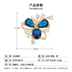 Crystal flower brooch wholesale featuring three prominent teardrop CZ petals surrounded by pavé ribbons and marquise crystal accents in gold plating from junejewelry.com