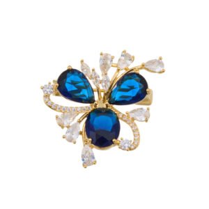 Crystal flower brooch wholesale featuring three prominent teardrop CZ petals surrounded by pavé ribbons and marquise crystal accents in gold plating from junejewelry.com