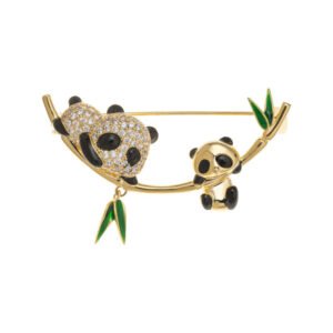 Double panda brooch wholesale featuring a micro-pavé cubic zirconia mother panda and smooth baby panda playing on a curved gold bamboo stalk with green enamel leaves from junejewelry.com