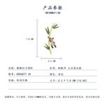 Playful Chinese style panda bamboo CZ brooch wholesale featuring a micro-pave cubic zirconia panda climbing a gold-plated bamboo stalk with vibrant green enamel leaves from junejewelry.com