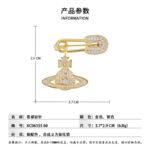 Trendy planet safety pin brooch wholesale featuring a pavé cubic zirconia encrusted safety pin header with a dangling crystal Saturn orb pendant from junejewelry.com