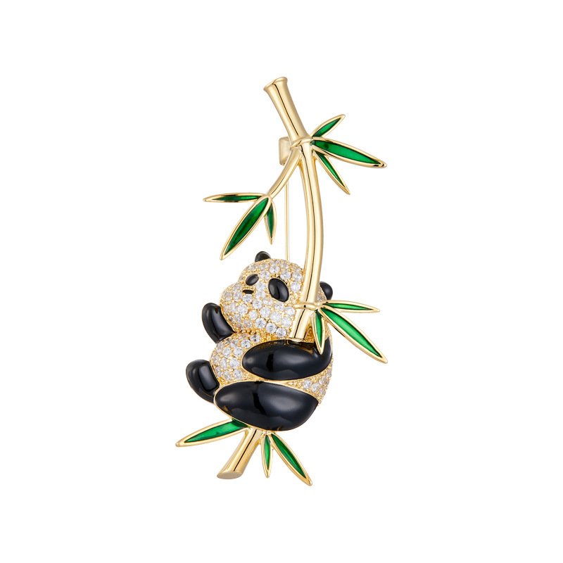 XC06372 (2) Playful Chinese style hanging panda bamboo CZ brooch wholesale featuring a chubby micro-pave cubic zirconia panda clinging to a gold-plated bamboo stalk with vibrant green enamel leaves from junejewelry.com