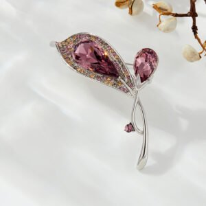 Crystal flower brooch wholesale featuring faceted teardrop glass petals bordered by multi-colored paved rhinestones on an elegant stem in silver plating from junejewelry.com