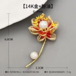 Oriental luxury Chinese style enamel lotus pearl brooch wholesale featuring translucent enamel petals, yellow enamel stamens, micro-pave CZ outlines, and dual freshwater pearls on a gold stem from junejewelry.com