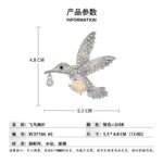 Hummingbird crystal brooch wholesale featuring an iridescent oval AB glass stone center, rainbow rhinestone-paved wings, and a dangling crystal beak charm in silver plating from junejewelry.com