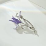 Iris brooch wholesale featuring purple enamel iris flower petals and silver-plated stems set with pavé cubic zirconia from junejewelry.com