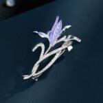 Iris brooch wholesale featuring purple enamel iris flower petals and silver-plated stems set with pavé cubic zirconia from junejewelry.com