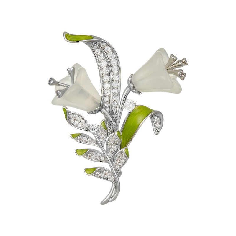 XC07353 (1) Light luxury white agate lily of the valley brooch wholesale featuring carved translucent white agate bell-shaped blooms, fresh green enamel leaves, and micro-pave cubic zirconia foliage on a silver setting from junejewelry.com