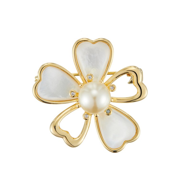Shell flower brooch wholesale featuring five gold-rimmed mother-of-pearl heart petals with a center faux pearl and cubic zirconia accents from junejewelry.com