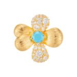 Four petal flower brooch wholesale featuring two brushed gold finish petals, two pavé cubic zirconia petals, and a turquoise stone center in gold plating from junejewelry.com