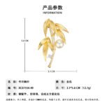 Elegant bamboo leaf pearl brooch wholesale featuring textured metallic leaves, a pavé cubic zirconia curved bamboo stalk, a sparkling solitaire round CZ accent, and a glossy pearl drop from junejewelry.com