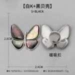 Elegant magnetic mother of pearl butterfly brooch wholesale featuring natural white or black shell wings, micro-pave cubic zirconia body, and a fabric-safe pinless magnetic back clasp from junejewelry.com