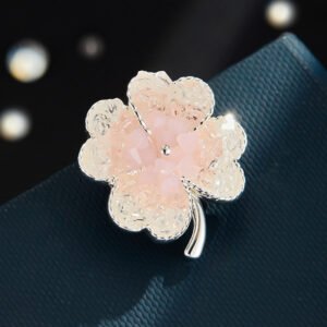 Elegant magnetic four leaf clover crystal brooch wholesale featuring four clover petals filled with crushed ice crystals and bi-color center accents, with a pinless magnetic back clasp from junejewelry.com