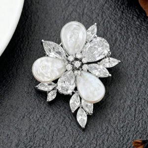 High-end baroque pearl flower CZ brooch wholesale featuring iridescent teardrop baroque shell petals, brilliant pear and marquise cubic zirconia stones, and detailed central stamens from junejewelry.com