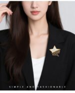 Star raindrop brooch wholesale featuring a smooth white mother-of-pearl shell star with dangling teardrop and round cubic zirconia raindrops from junejewelry.com