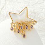 Star raindrop brooch wholesale featuring a smooth white mother-of-pearl shell star with dangling teardrop and round cubic zirconia raindrops from junejewelry.com