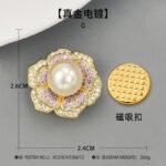 High-end magnetic camellia CZ pearl brooch wholesale featuring micro-pave white and purple cubic zirconia petals, a luminous glass pearl center, and a strong pinless magnetic back clasp in gold or rhodium finish from junejewelry.com
