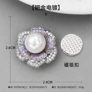 High-end magnetic camellia CZ pearl brooch wholesale featuring micro-pave white and purple cubic zirconia petals, a luminous glass pearl center, and a strong pinless magnetic back clasp in gold or rhodium finish from junejewelry.com