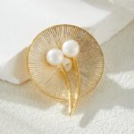 Pearl round brooch wholesale featuring a textured radial disc design adorned with dual freshwater pearls and sparkling cubic zirconia stones from junejewelry.com