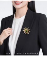 Dazzling firework pearl crystal brooch wholesale featuring radiating metallic rays set with round pearls and pave cubic zirconia centered around a brilliant jewel gemstone, with convertible pendant hook functionality from junejewelry.com