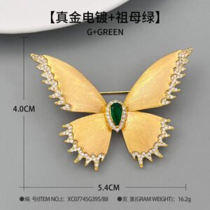 Brushed gold butterfly brooch wholesale featuring textured matte wings with cubic zirconia paved edges and a teardrop center stone from junejewelry.com