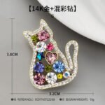 Playful and elegant colorful rhinestone cat brooch wholesale featuring a hollow sitting cat silhouette framed in micro-pave crystals and filled with multi-color Czech rhinestones, heart, and star accents in gold or rose gold finish from junejewelry.com