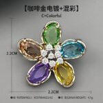 Colorful five-petal flower brooch pin wholesale featuring oval-cut cubic zirconia crystal petals with a micro-pave CZ centerpiece from junejewelry.com