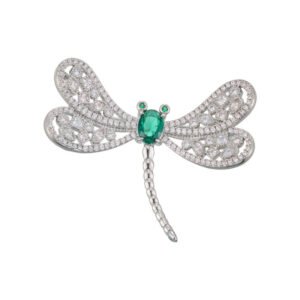 Dragonfly brooch wholesale featuring openwork filigree wings set with clear cubic zirconia, an oval gemstone body, and green CZ eyes from junejewelry.com