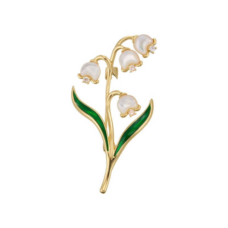 Lily of the valley brooch wholesale featuring carved mother-of-pearl shell bell flowers with cubic zirconia accents and green enamel leaves from junejewelry.com