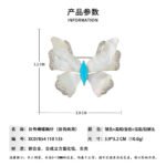 Shell butterfly brooch wholesale featuring iridescent mother-of-pearl wings with cubic zirconia paved edges and a marquise-cut center stone from junejewelry.com