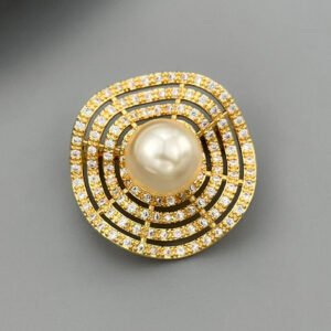 Geometric concentric circle pearl brooch wholesale featuring multi-tiered rings encrusted with micro-pavé cubic zirconia surrounding a large center pearl from junejewelry.com